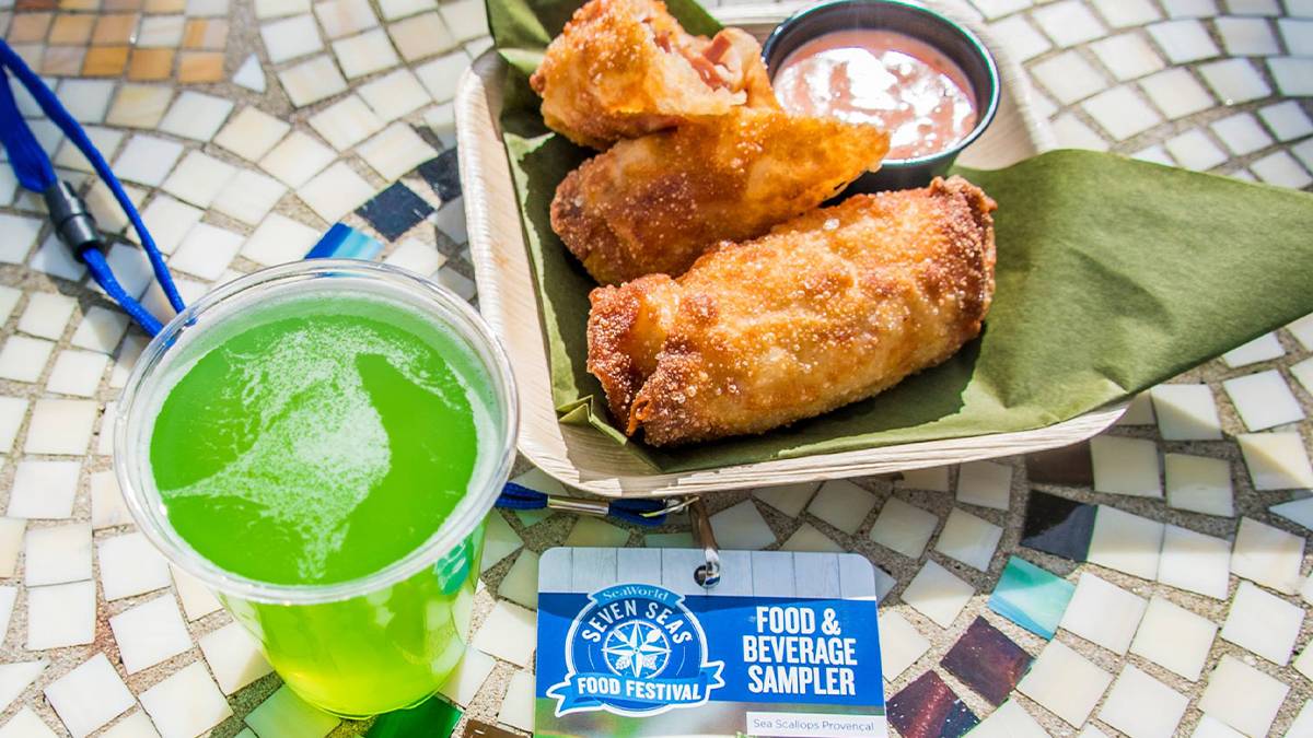 Close up of Rueben Egg Rolls and a green beer on a mosaic table for St. Patrick's Day during the Seven Seas Food Festivals at SeaWorld in Orlando, Florida, USA