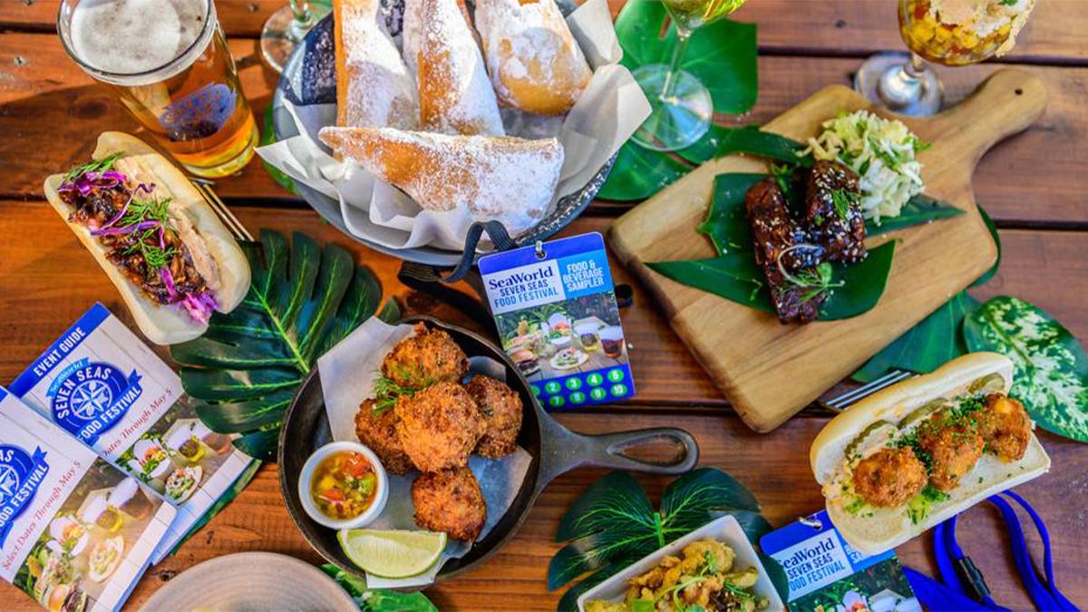 View of a table full of different types of food and passes to the Seven Seas Food Festivals at SeaWorld in Orlando, Florida, USA