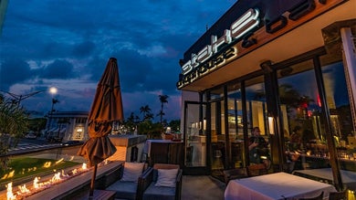 View of the Stake’s Fireside Patio at dusk with a cloudy sky in San Diego, California, USA