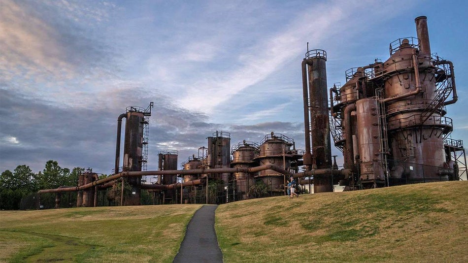 Wide shot of Gas Works Park, a giant industrial structure surrounded by grass and walking trails in Seattle, Washington, USA