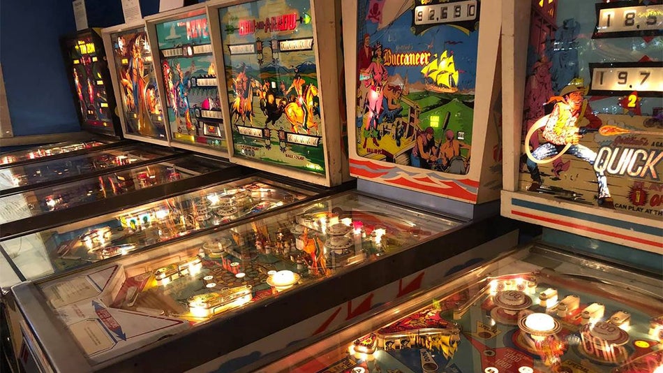 Close up of several old pin ball machines in a row at the Seattle Pinball Museum in Seattle, Washington, USA