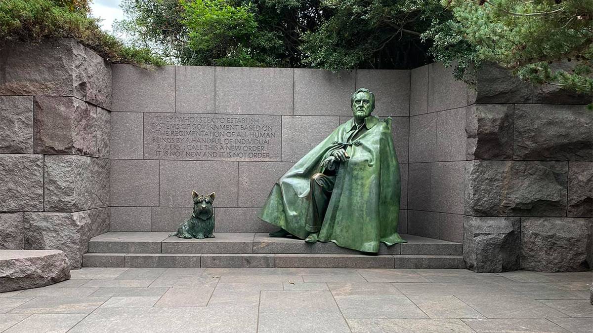 Close up of a statue of FDR and his dog at the Franklin D Roosevelt Memorial in Washington, DC, USA