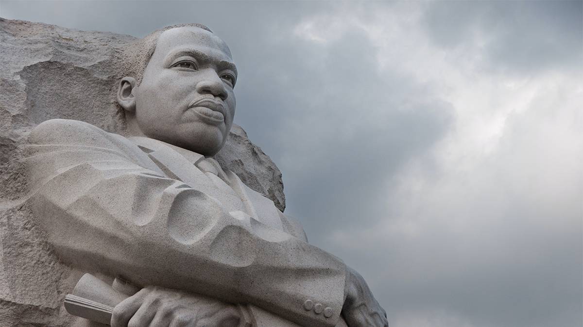 Close up of the Martin Luther King Jr Memorial, a massive incomplete statue of of Martin Luther King Jr made out of white stone on a cloudy day in Washington, DC, USA