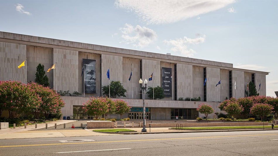 Wide shot of the exterior of the National Museum of American History on a sunny day in Washington, D.C., USA