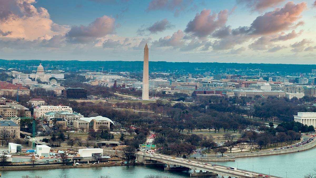 Aerial view of DC at sunset with a cloudy sky in Washington, DC, USA